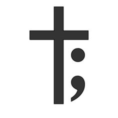 a black and white image of a cross with the word jesus on it's side