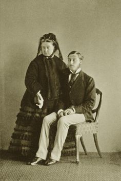 an old black and white photo of two people