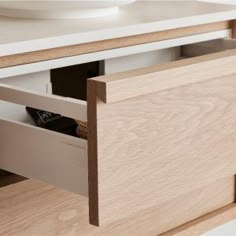 an open drawer in a wooden cabinet