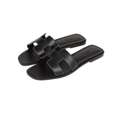 This pair of Oran Sandals are in black box leather with contrast stitching and feature the iconic H crossover strap. Origin: ItalyCondition: Pristine; new or never Accompanied by: Hermes box, dustbags, carebook and ribbonSize: 38 EU Black Hermes Oran Sandals, Flat Sandals Black, Black Flats Sandals, Hermes Black Sandals, Black Hermes Sandals, Hermes Sandals Black, Hermes Oran Black, Hermes Sandals, Hermes Oran Sandals