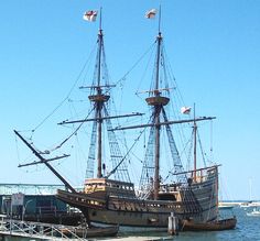 an old pirate ship is docked in the water