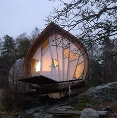 an unusual house built into the side of a hill