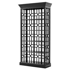 a tall black shelf with an intricate design