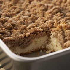 a close up of a cake in a pan with crumbs on the top