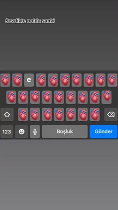 a keyboard with red hearts on it and the words, love is in the middle