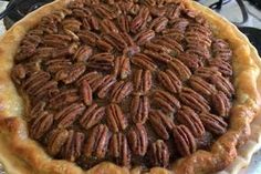 a pecan pie sitting on top of a stove