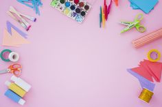 craft supplies laid out on a pink background