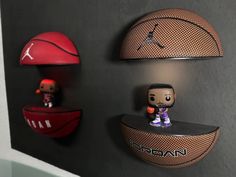 two shelves with basketballs and pop figures on them