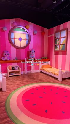 the children's room is decorated in pink and green colors with watermelon rugs