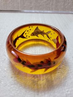 Sea Life Series Translucent Bakelite Bangle  3.38 oz I.D. 2.5" O.D. 3.25" 7/8" wide Tested Clear Bangle Bracelet For Gifts, Clear Bangle Bracelet As A Gift, Unique Orange Bangle Jewelry, Clear Bracelet Jewelry For Formal Occasions, Clear Bangle For Formal Occasions, Clear Bangle Jewelry For Formal Occasions, Bakelite Bangles, Life Series, Necklace Patterns