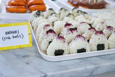 there are many different types of donuts on display in the trays at this event