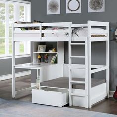 a white loft bed with stairs and desk