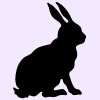 a black silhouette of a rabbit sitting on the ground with its ears up and eyes closed