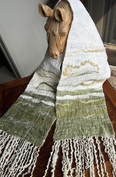 I make one-of-a-kind wet felted scarves using a silk backing in the Nuno felting technique.  The 100% wool face with 100% silk backing provides a soft, luxurious hand and warm comfort on chilly days.  The unique patterns create wearable art to accent any outfit, day or night.  Natural sheep locks are used as fringe and not included in the overall listed width. Decolonizing Design, Felted Scarf, Wet Felt, Felted Scarves, Nuno Felting, Wet Felting, Felt Art, Shibori, Design Project