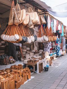 an outdoor market with baskets and other items