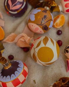 an assortment of painted eggs on a table