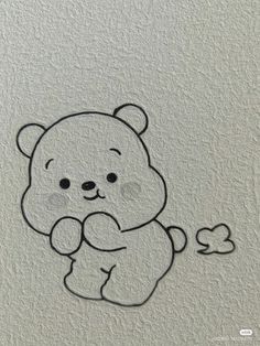 a drawing of a teddy bear holding a heart