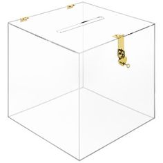 a clear plastic box with gold handles