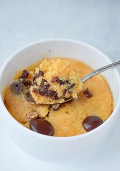 a white bowl filled with pudding and chocolate chips