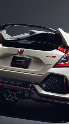 the rear end of a white sports car