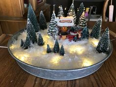 a tin pan filled with christmas trees and lights