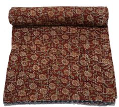 a red and brown floral print fabric