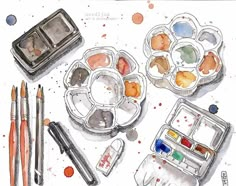 an artist's watercolor and ink painting set with paintbrushes, palettes and other art supplies