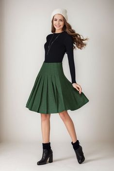 ★★ Welcome to my Ylistyle shop！！！ Stay cozy and chic in this vibrant Emerald wool Midi skirt, a must-have for the colder months! Embrace the winter in style with this versatile #WoolSkirt featuring a flattering High Waist design and a trendy Circle Skirt silhouette. Elevate your winter fashion game effortlessly with this Green beauty.  ★★FEATURES 25% wool, other fiber,nylon Polyester lining Right side zipper A-line skirt Regular fit  Circle skirt Pleated skirt Above knee length Perfect for winter, autumn ★★ Bespoke Order Service If you Request other color Request the length Your height is not between 155 cm- 172 cm Your weight is over 75 kg I can do it for you, It will need some extra fee depending on on your need. Contact with me for more detail. ★★ Get your size in Size Chart with your b Green Lined Skirt For Fall, Winter Knee-length Lined Pleated Skirt, Green Midi Skirt For Fall, Fall Green Mini Skirt For Work, Chic Green Winter Skirt, Chic Green Skirt For Winter, Casual A-line Pleated Skirt For Winter, Elegant Green Mini Skirt For Fall, Winter Workwear Pleated Mini Skirt