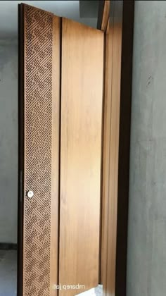 an open wooden door in the corner of a room