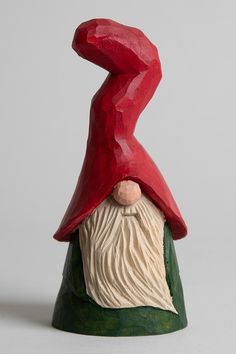 a red gnome's hat on top of a green base