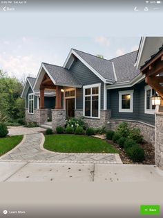 a house that is in the middle of some grass