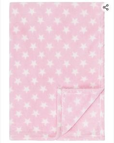 a pink blanket with white stars on it