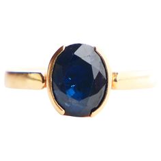 A ring with band in solid 18K Yellow Gold and oval cut natural Sapphire 9 mm x 7 mm x 4.6 mm deep / ca. 2.25 ct. The stone is dark Blue with flaws and inclusions visible inside. Hallmarked 18K, made in Sweden in 1997 (Year Combination Y10 ) Size Ø 6.75 US / 17.13 mm. No traces of sizing. This ring can be professionally resized. Weight: 4.2 grams Used, in fine condition. Very firm and secure setting. Minor wear to the facets of the Sapphire. > Most of the items that we sell are not new at all if Old Rings, Photo Equipment, Vintage Sapphire, Old Jewelry, Natural Sapphire, Solitaire Ring, Ring Verlobung, Necklace Lengths, 18k Gold