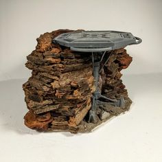 a star trek table sitting on top of a pile of wood