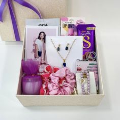 a gift box filled with jewelry and personal care items for the woman in your life