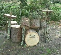 a tree that has been cut down and is sitting in the dirt next to some logs