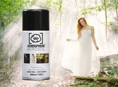 a woman in a white dress standing next to an aerosol spray