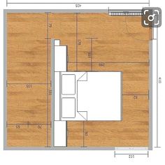 the floor plan for an apartment with wood floors and white furniture, including a bed