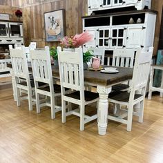 a dining room table and chairs in a store