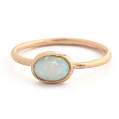 Aurora Opal Ring – Kate Davis Jewelry Minimalist Opal Stackable Promise Rings, Oval Ethiopian Opal Birthstone Ring, Everyday Stackable Opal Ring, Ethiopian Opal Birthstone Rings, Fine Jewelry Stackable Opal Promise Ring, Stackable Opal Promise Ring In Fine Jewelry Style, Celestial Oval Opal Birthstone Ring, Celestial Opal Birthstone Ring In Oval Shape, Minimalist Opal Rings With Gemstone