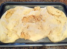 a pan filled with food sitting on top of a counter