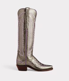 Our No. 1 bestselling boot for women, Priscilla walks an elegant line between timeless classic and cowgirl chic. The vintage-inspired Tioga stitch pattern harks back to yesteryear, but Priscilla is a boot built for today. This knee-skimming, pull-on silhouette handcrafted from supple cowhide leather deserves the spotlight under dresses and over jeans. Handmade in Texas. Blue Metallic Cowgirl Boots, Lucchese Priscilla Boots, Luxury Women's Ankle-high Cowboy Boots, Luxury Fitted Knee-high Cowboy Boots, Luxury Leather Ankle-high Cowboy Boots, Barn Boots, Polo Shoes, Boot For Women, Lucchese Boots