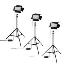 three light stands with lights attached to them