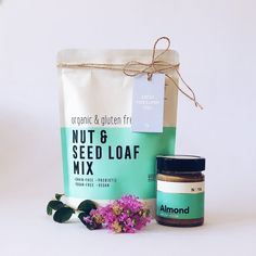 an organic and gluen free nut & seed loaf mix next to a bag of nuts