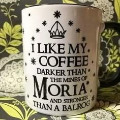 a coffee mug with the words i like my coffee darker than the mines of moria and stronger than a balrog