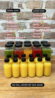 there are many different types of juices in bottles on the table with words above them