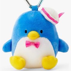 a blue penguin with a pink bow tie and a hat on it's head