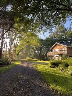 the house is surrounded by trees and grass