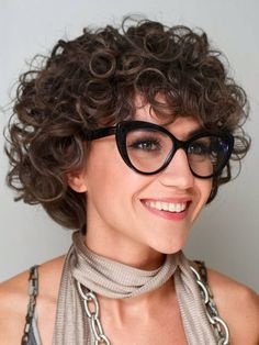 Short curly haircut for women with glasses, showcasing natural curls and flattering layers Haircuts For Women With Glasses, Women With Glasses, Facial Features