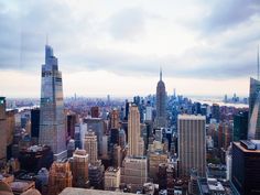 an aerial view of new york city with skyscrapers